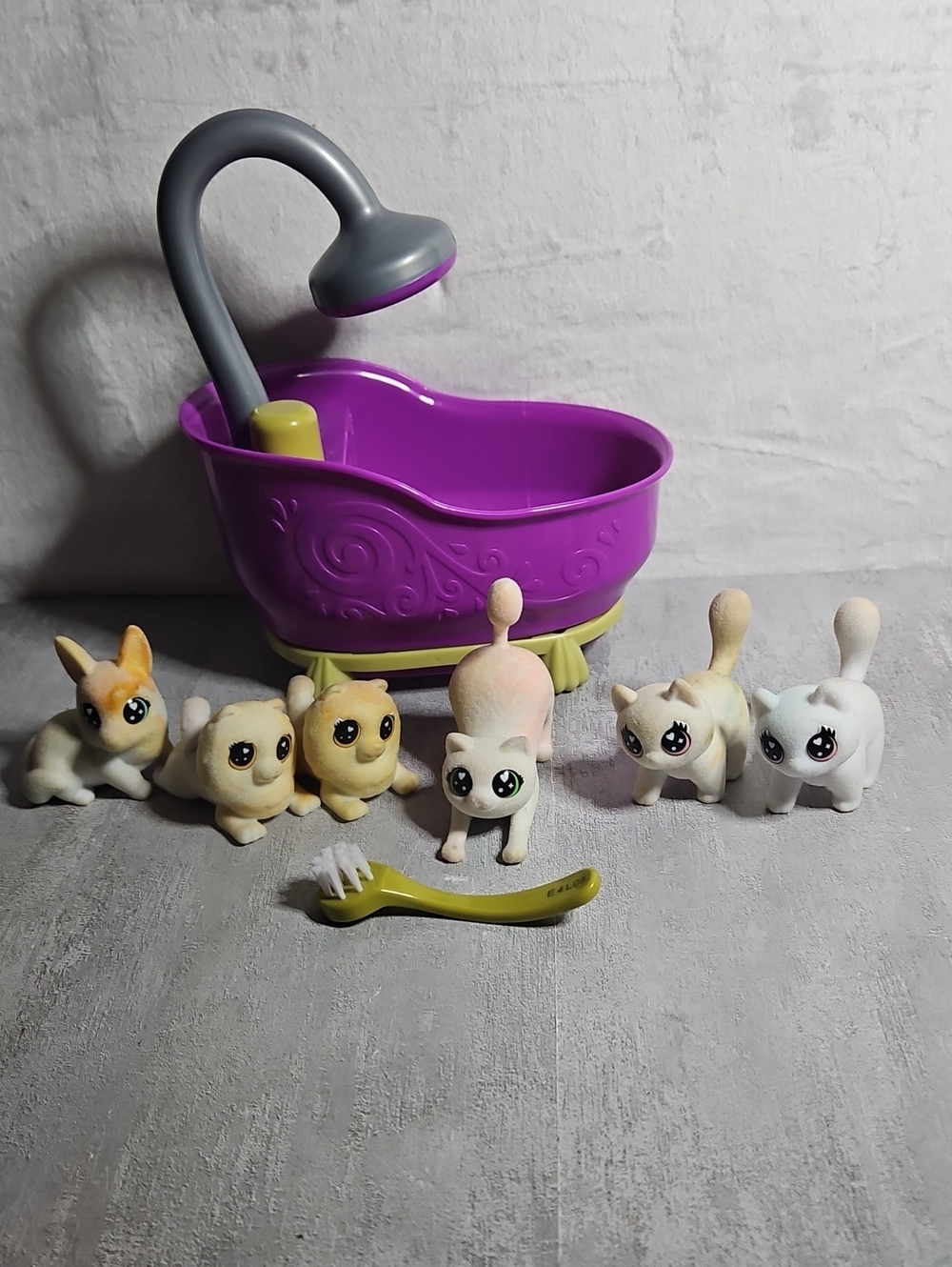 collection of Crayola Scribble Scrubbie Pets figures and a purple scrub tub